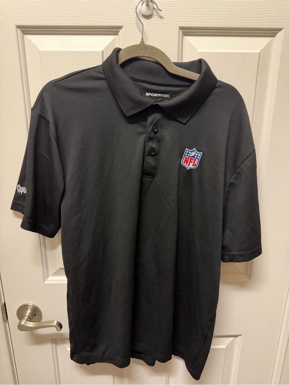 Sport-Tek Black Polo with NFL Shield Patch